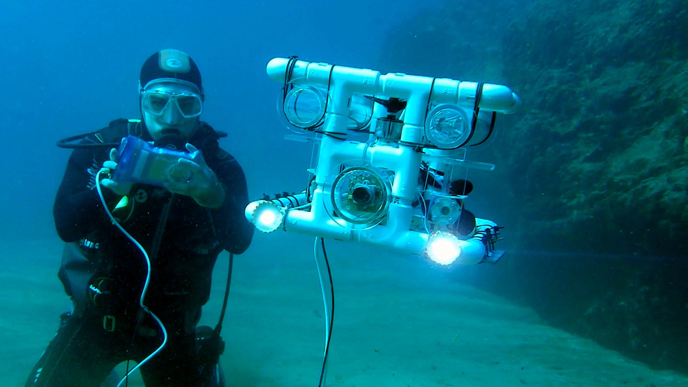 Andrej diving with his scuba diving robot
