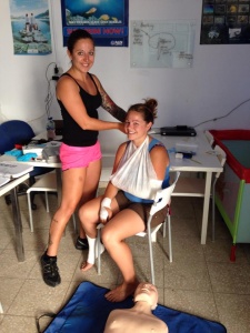 Corinne practicing bandaging on her Emergency First Response course in Lanzarote